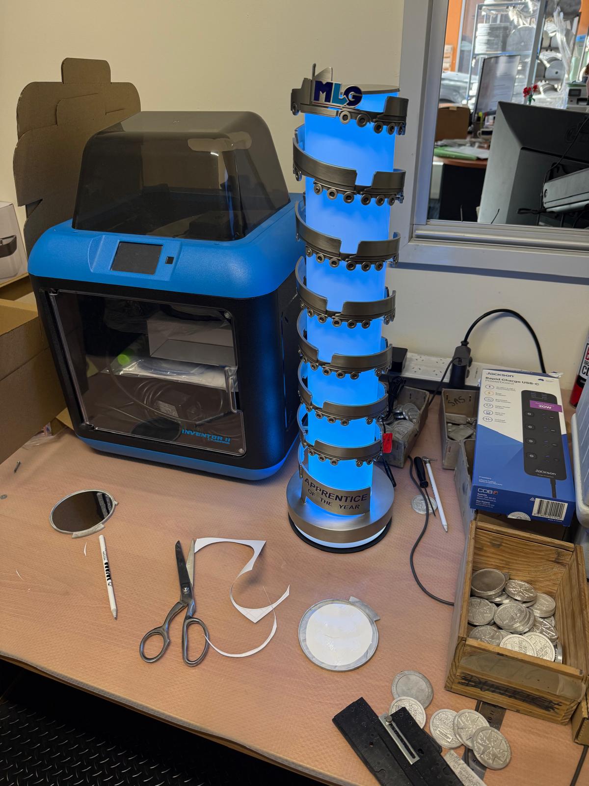 Custom illuminated recognition award undergoing assembly, lighting integration and testing in the Buckingham Pewter workshop.