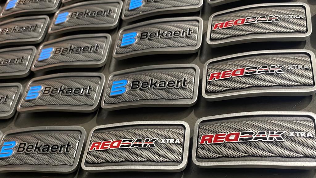 Custom branded recognition pieces produced for industrial clients.
