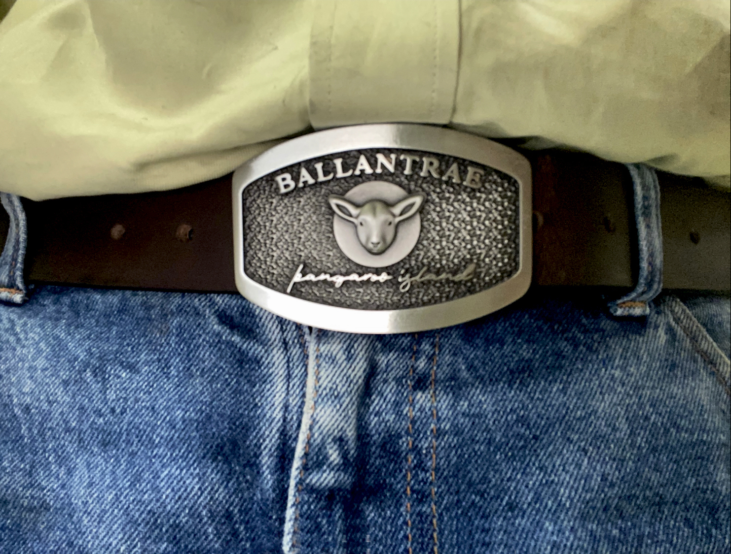 Custom Ballantrae belt buckle worn on a leather belt.