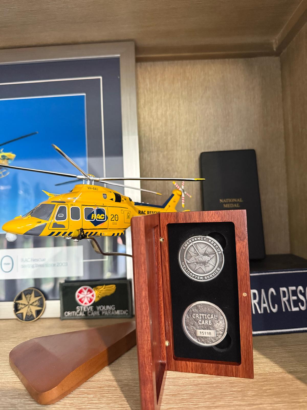 Finished challenge coin presentation set displayed in a timber presentation box.