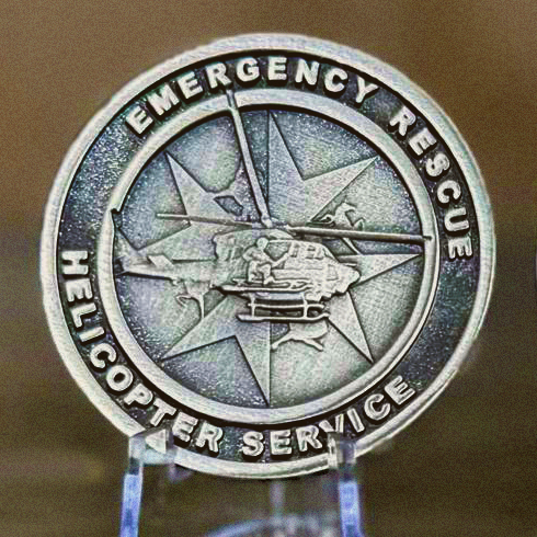 Emergency Rescue Helicopter Service commemorative coin featuring a rescue helicopter design.