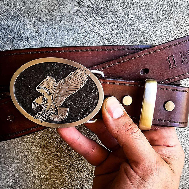 Custom recognition belt buckle featuring an eagle motif and supplied with a leather belt.