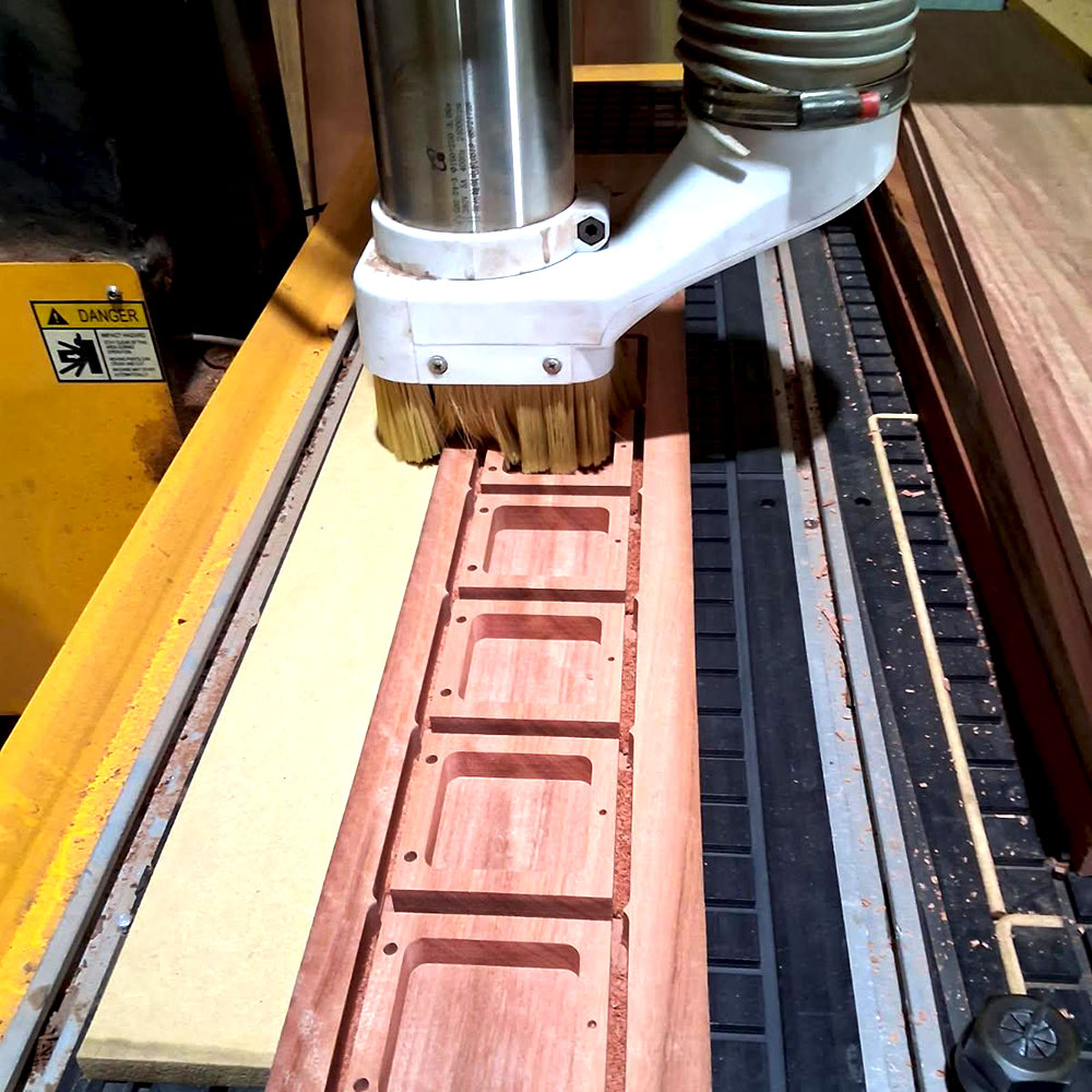 CNC machining Jarrah timber presentation boxes for custom recognition products at Buckingham Pewter in Perth, Western Australia.