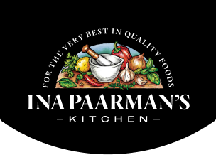 Logo with mortar and pestle surrounded by colorful vegetables and text Ina Paarman's Kitchen.