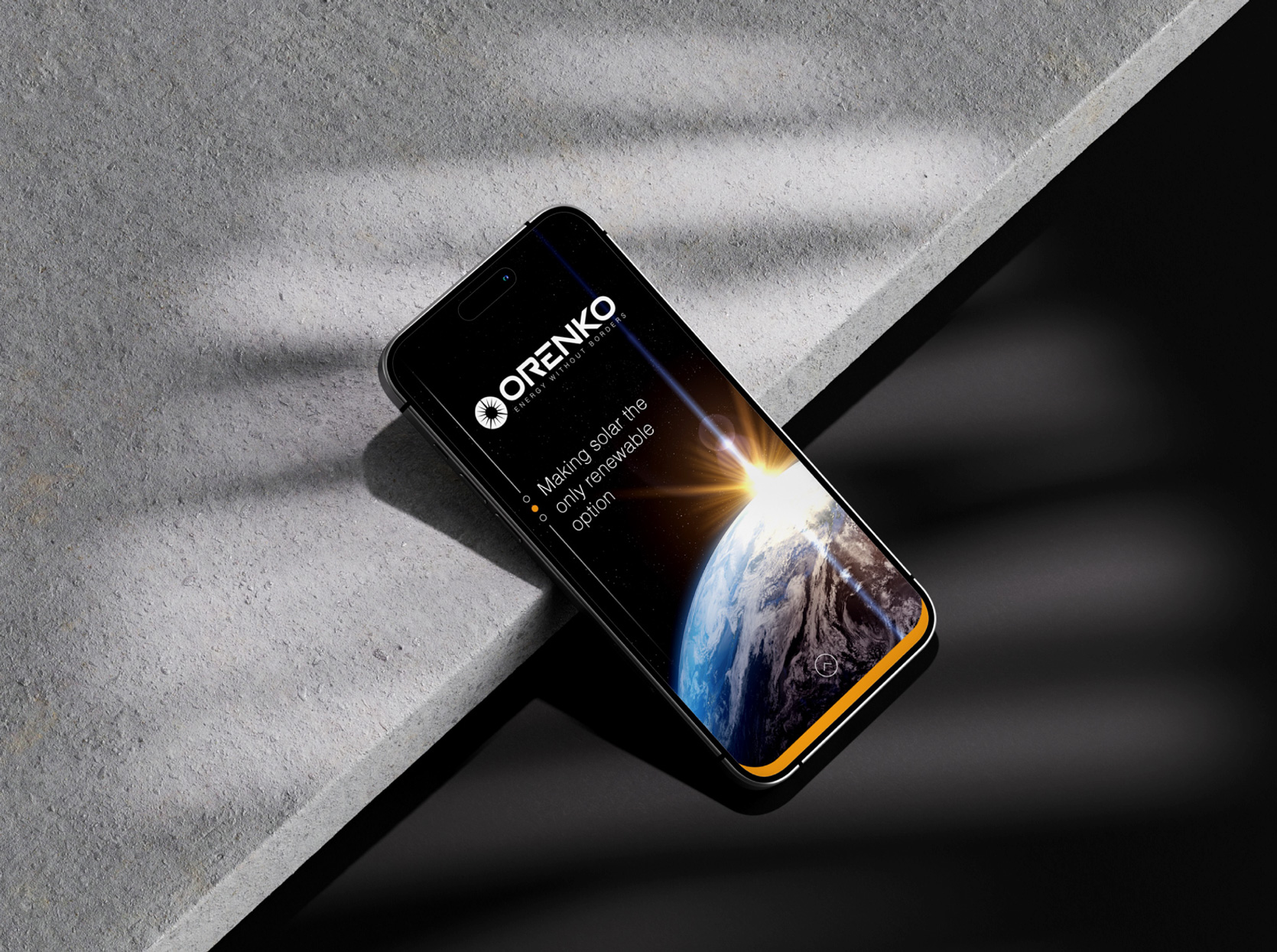 Smartphone on a dark surface with a screen showing Earth and sunlight with ORENKO solar message.