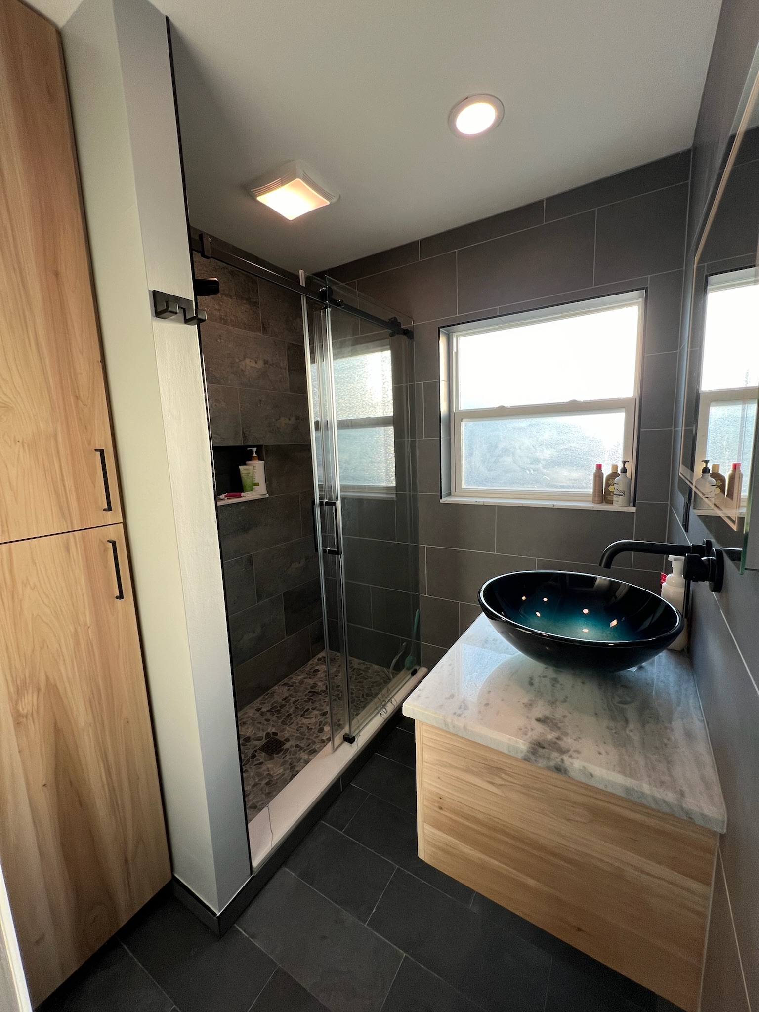 Herringbone shower with Stone FIBO wall panels