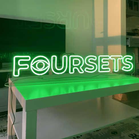 Foursets neon sign in the new Warsaw office, 2023