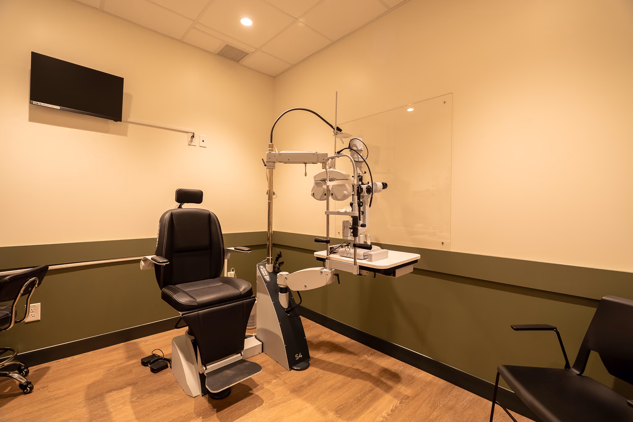 Eye exam room at Vision Care Woodward with diagnostic testing equipment.