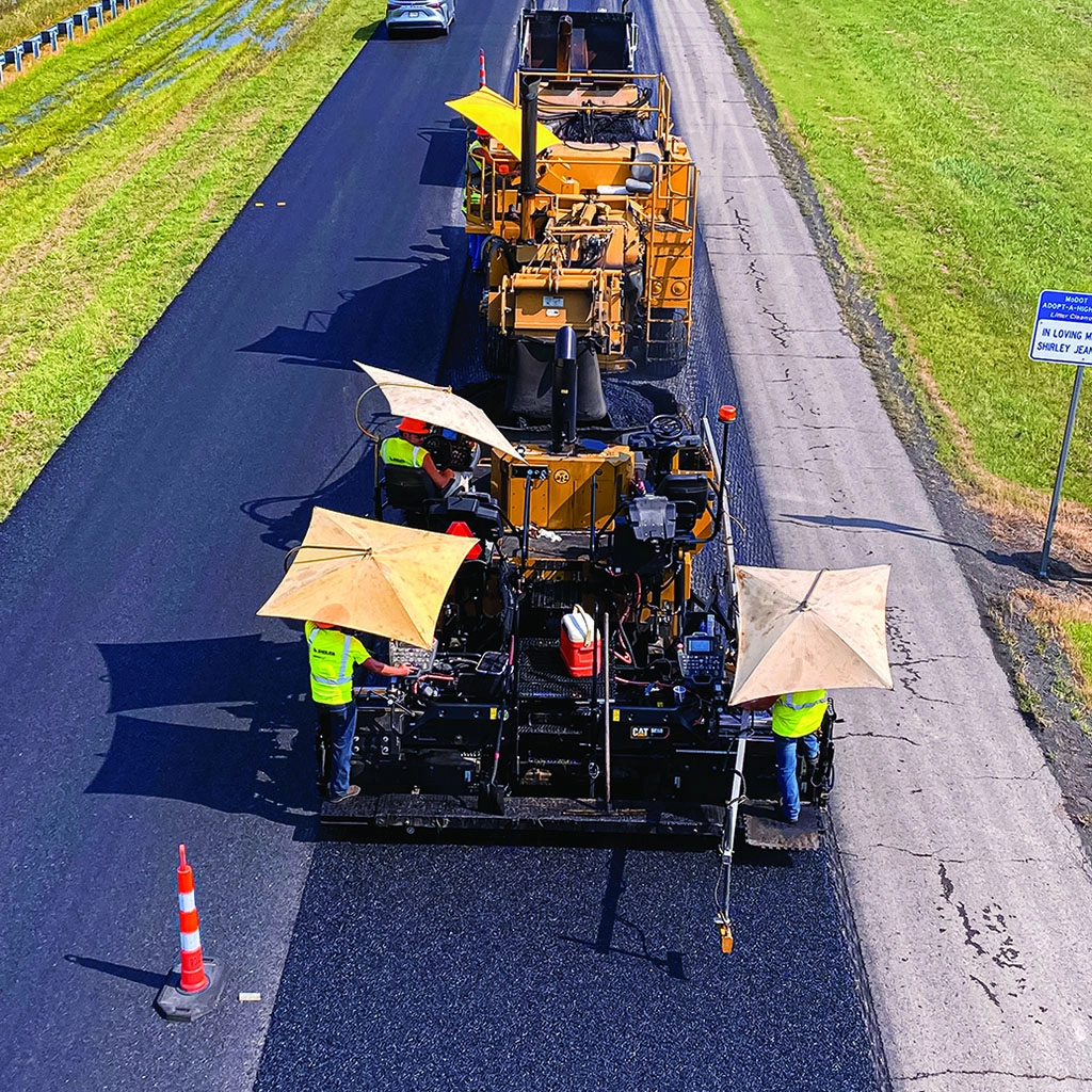 Asphalt paver laying a new road