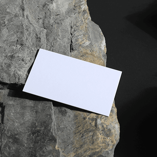 Business Card on a Stone With Black Background