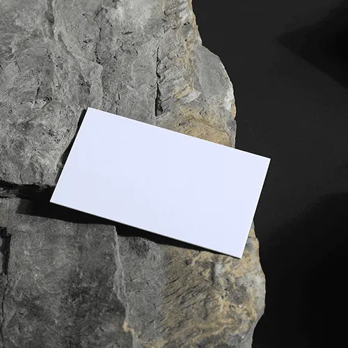 Business Card on a Stone With Black Background