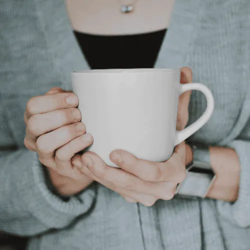 Woman Holding A Cup Mockup