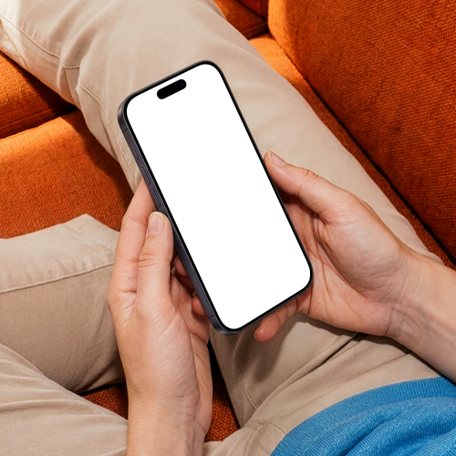 iPhone 17 Pro Mockup Held in Hand on Sofa