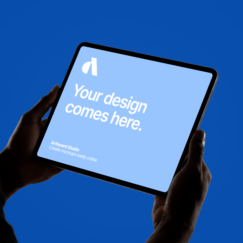 Silhouetted Hands Holding iPad Pro 13-inch Mockup
