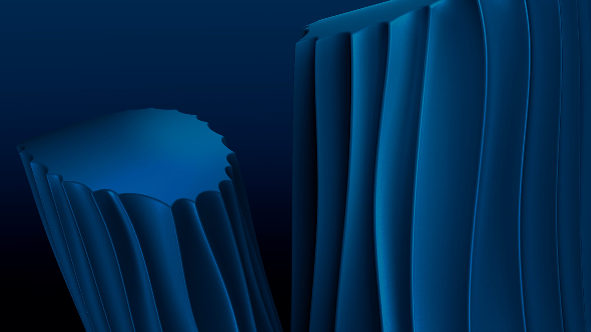 Abstract blue 3D shapes with vertical ridges on a dark blue gradient background.