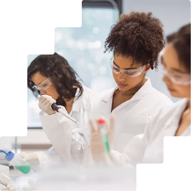 Female students pipetting samples in academic lab