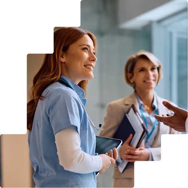 Smiling nurse and consultant in conversation