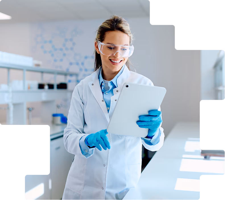 Lab technician recording clinical data on a tablet.