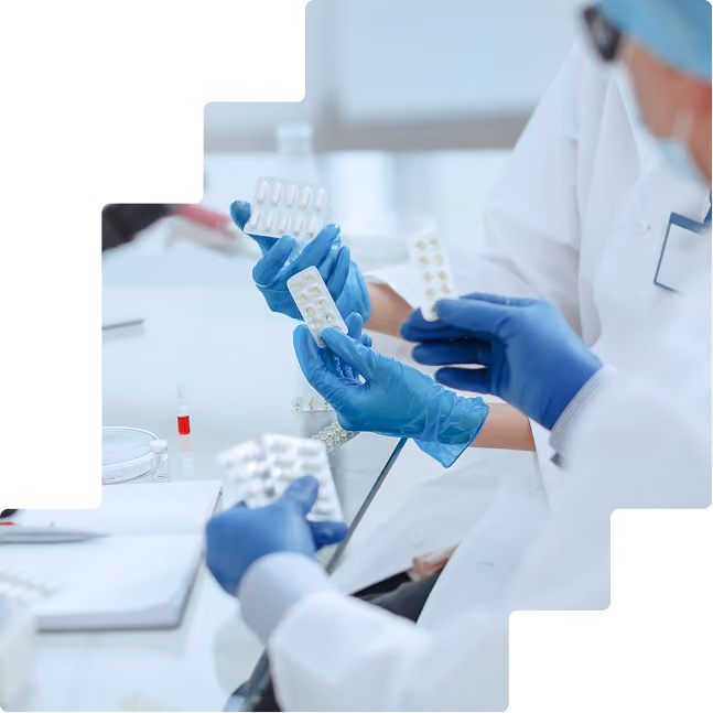 Hands with blister packs: Clinical trial staff in gloves inspecting blister packs of investigational medication
