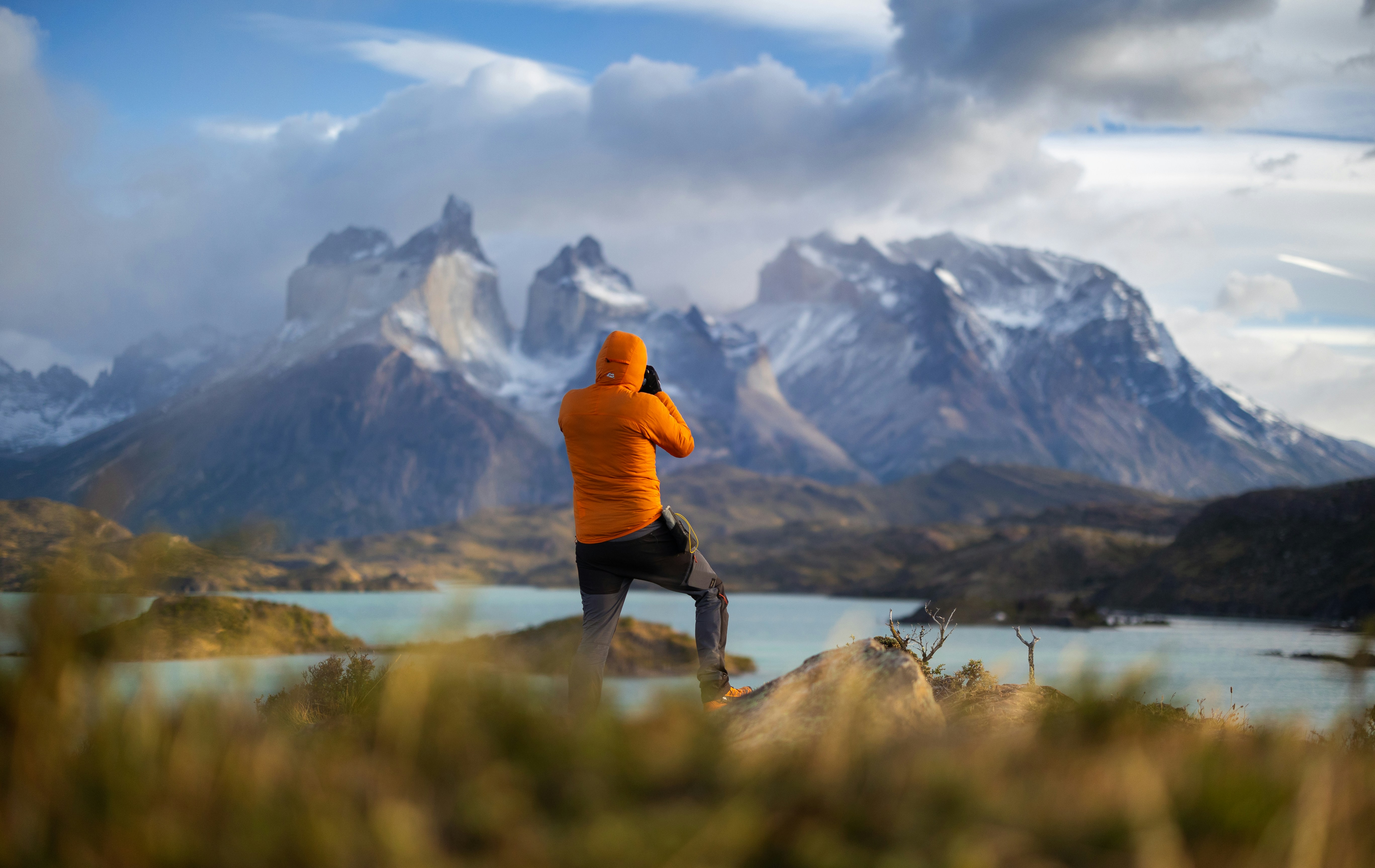 Respectful birder observing wildlife from a distance on a quiet Patagonian trail