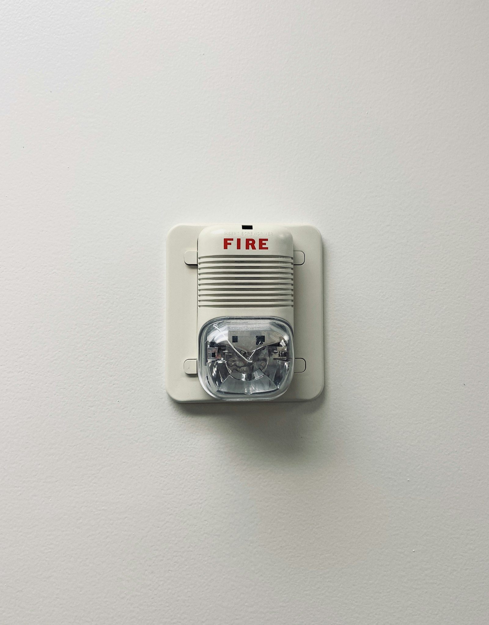 Smoke detector and carbon monoxide detector installed on residential ceiling