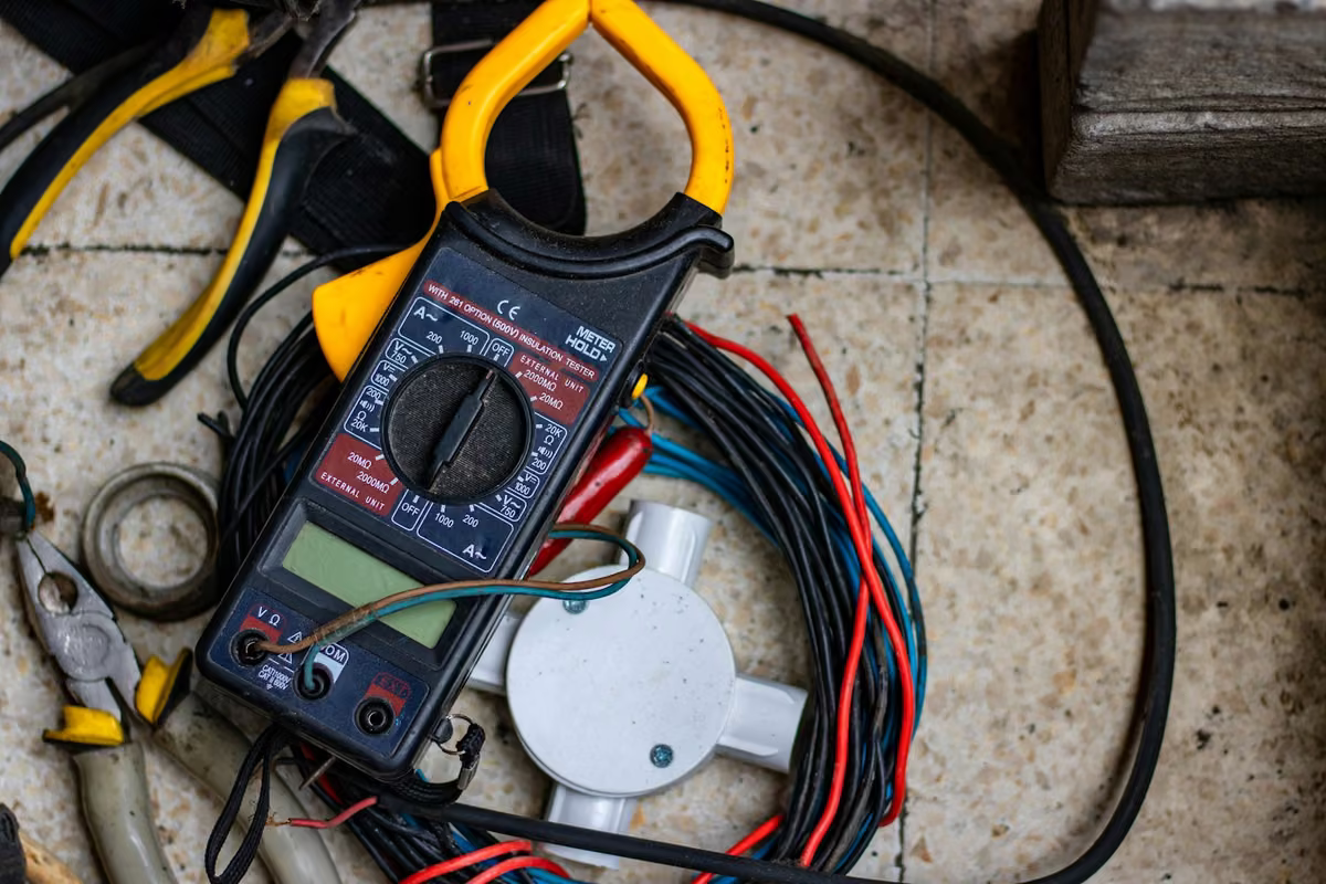 Trapani Electric technician performing emergency electrical repair at a commercial building