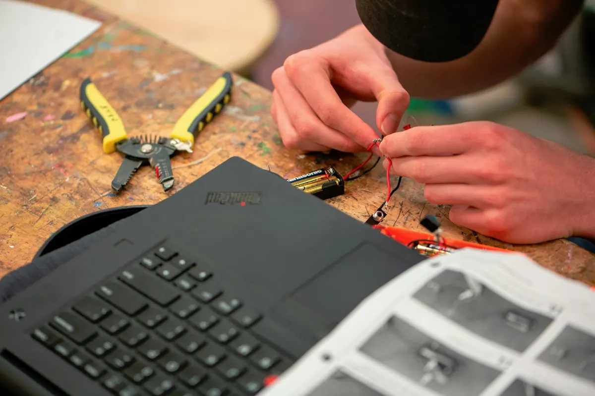 Erik Trapani working on a commercial electrical panel