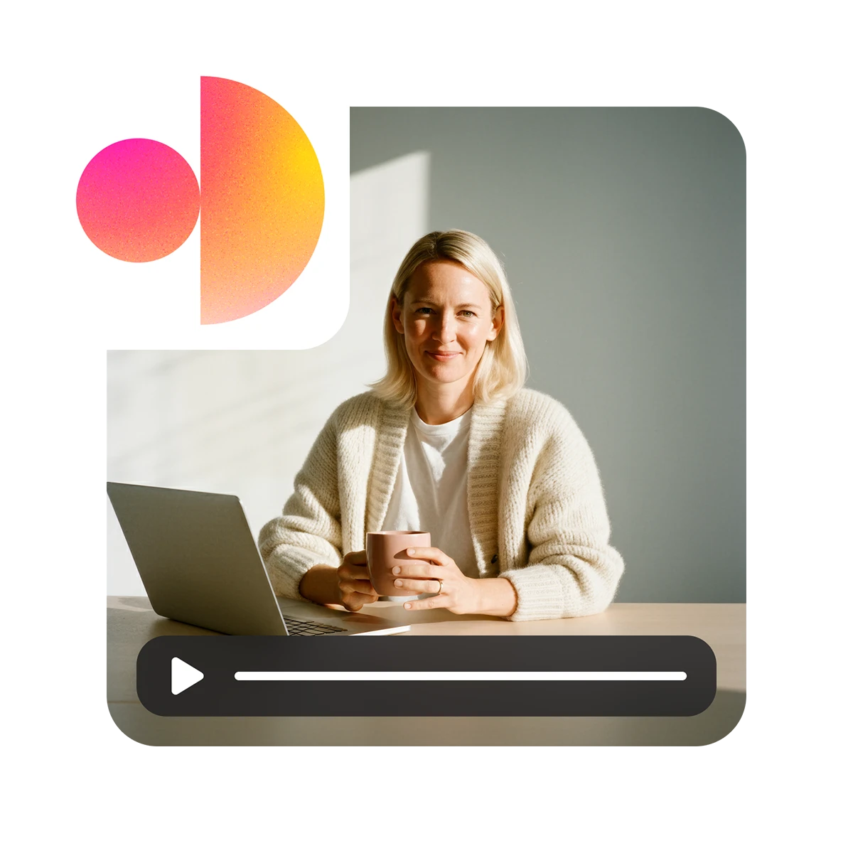 Smiling woman in a cream sweater sitting at a table with a laptop and holding a coffee mug, with a video play bar overlay.