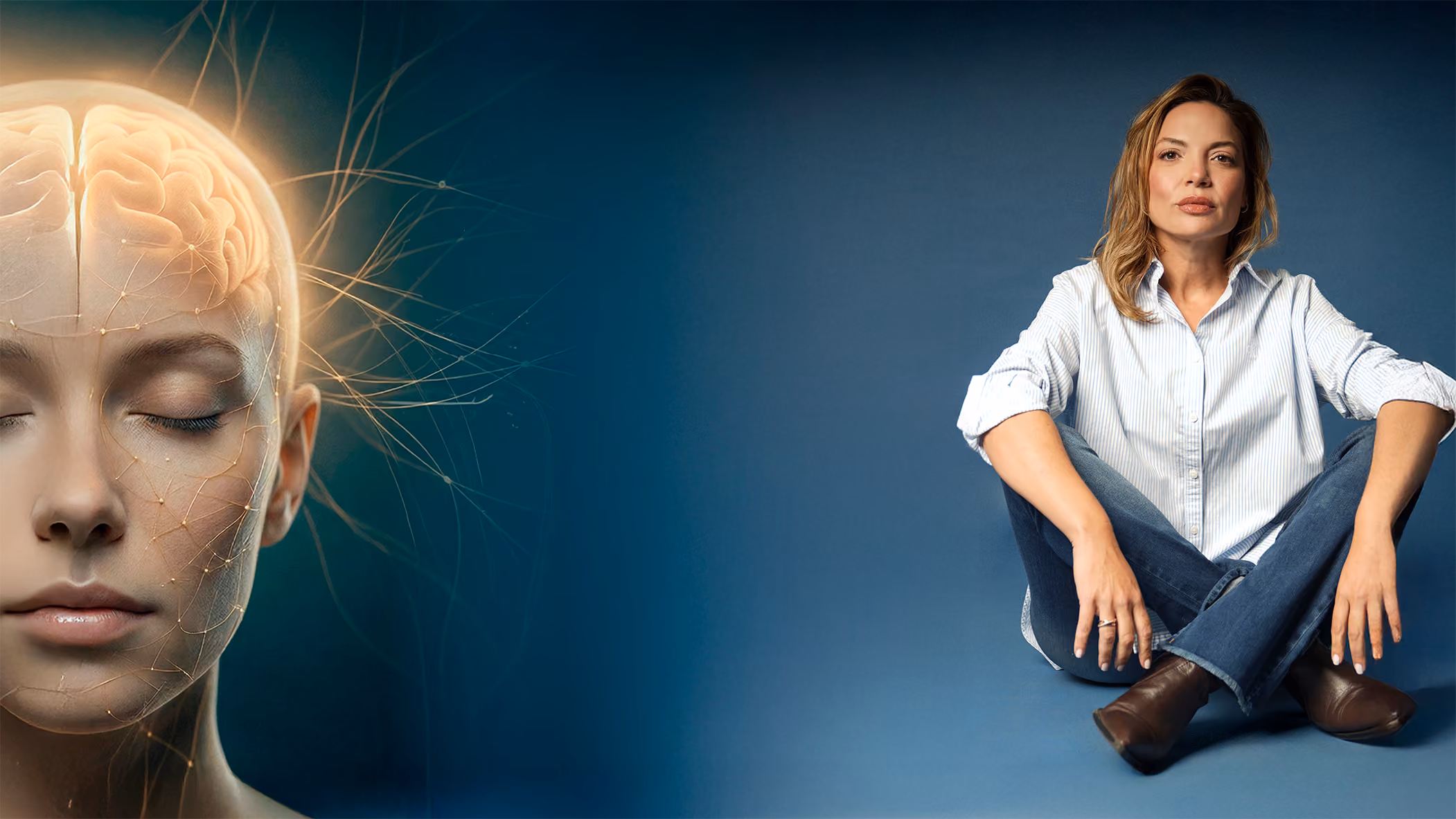 Young woman sitting cross-legged on blue floor next to digital image of glowing human brain.