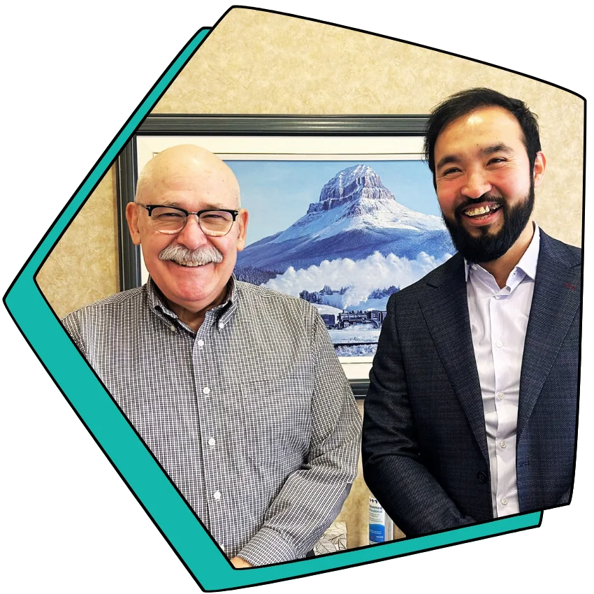 Dr. Spackman and Dr. Farozi smiling.