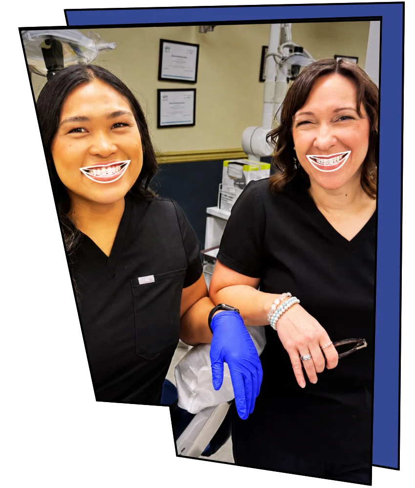 Two hygienists smiling.