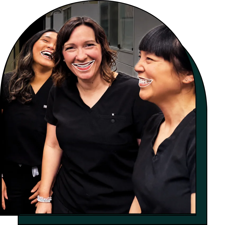 Hygienists laughing together.