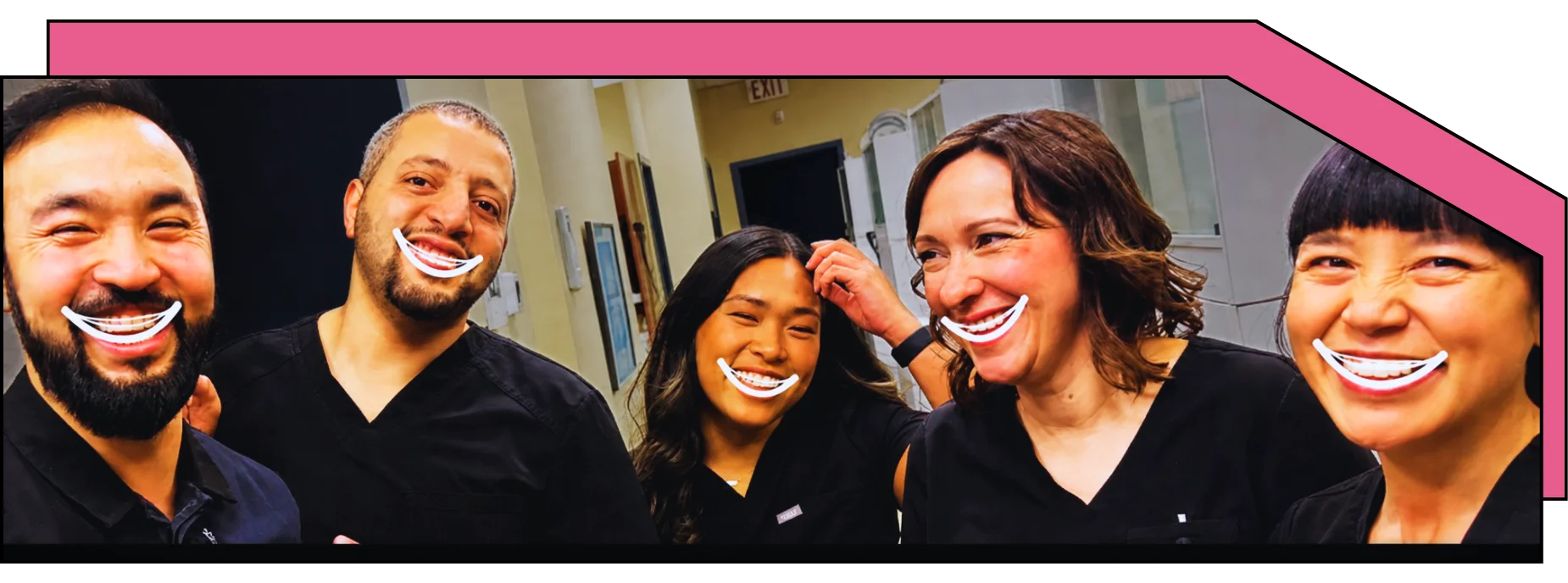 Dental team laughing together.