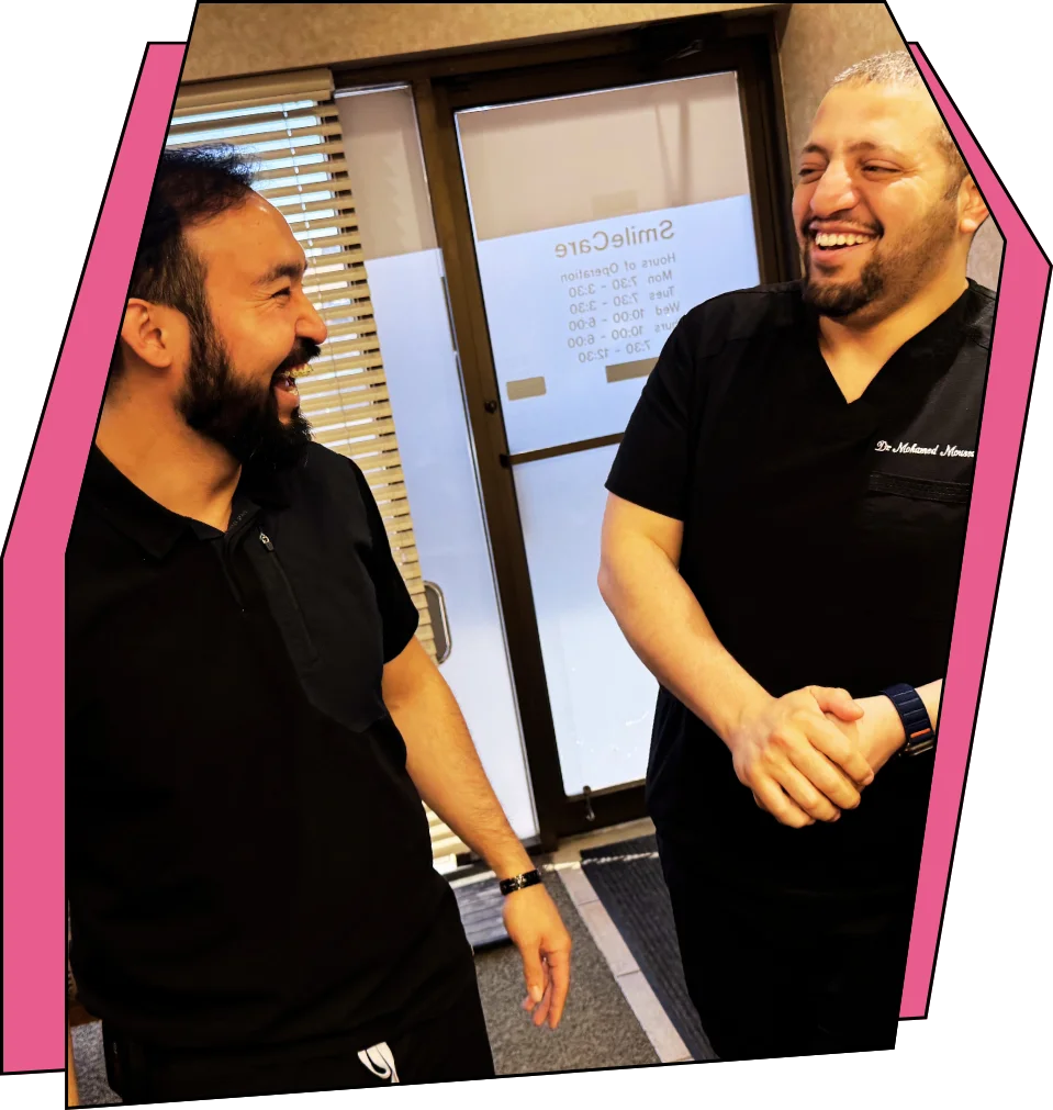 Dr. Farozi and Dr. Moussa laughing together.