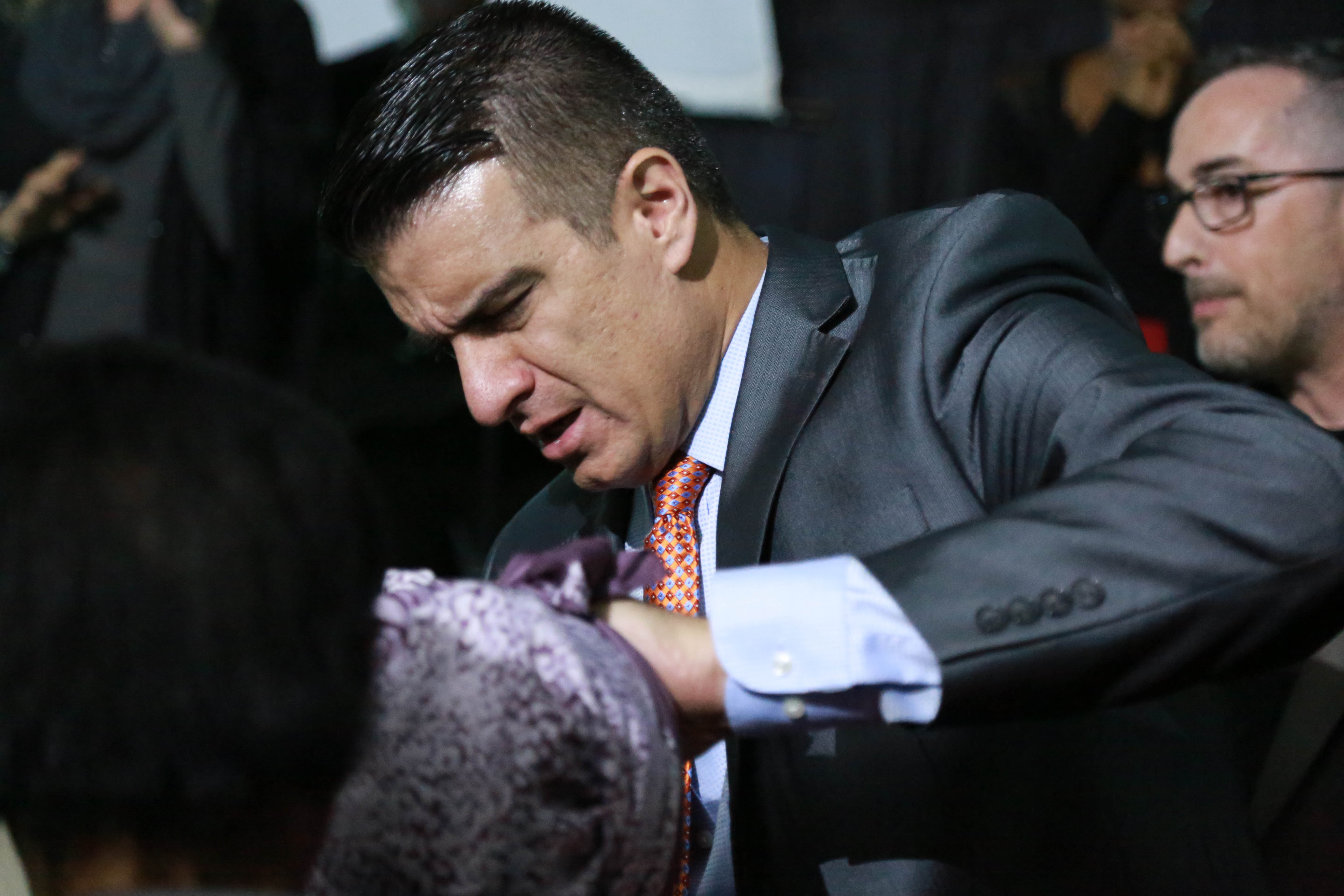 Jeff Taylor ministering to someone during a revival meeting