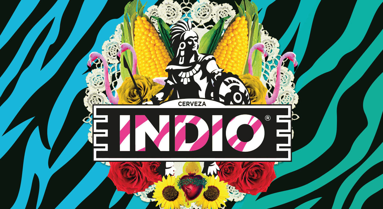 Close-up of the Indio label artwork: the logo framed by corn cobs, a skeletal Catrina-style figure, a lace doily, roses, and sunflowers on teal zebra stripes.