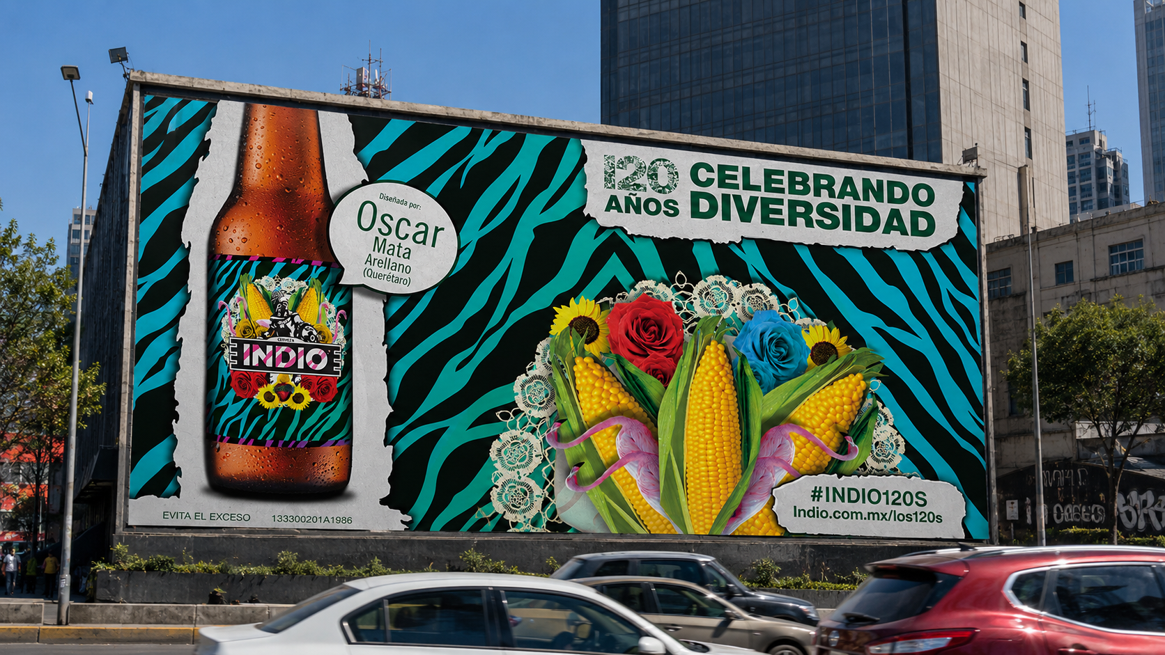 Mockup of an outdoor billboard in Mexico City reading "120 años celebrando diversidad," crediting designer Oscar Mata Arellano (Querétaro), featuring an Indio bottle and a bouquet of corn and roses, with traffic in the foreground.