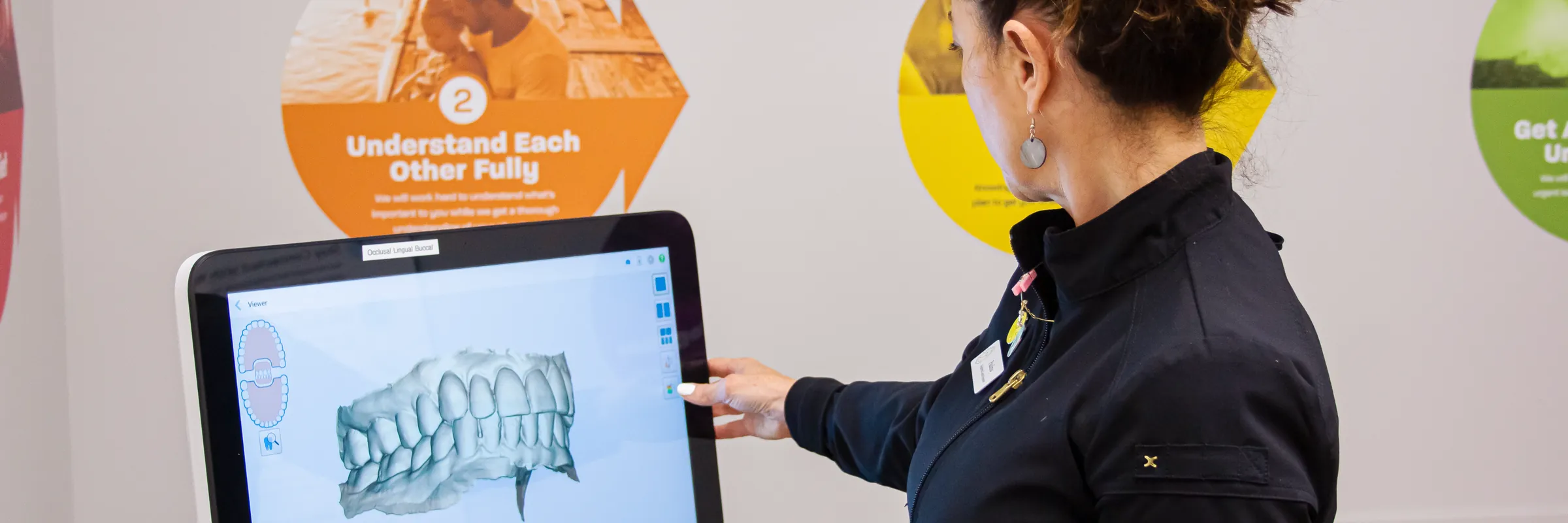 Team member showing a 3D scan of a patient's teeth at Renken Dentistry