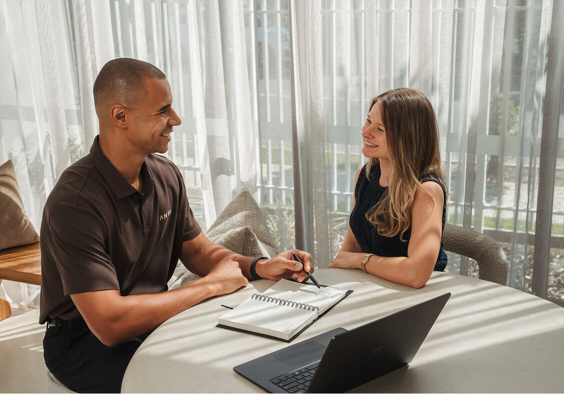 Chima Anyanwu talking with an ANYA Finance Client