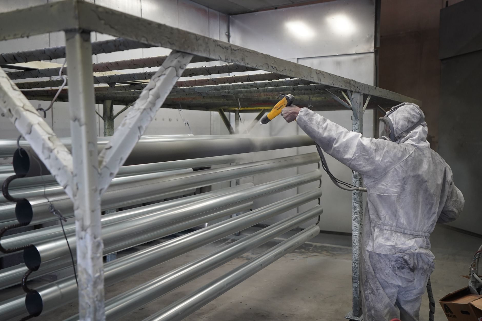 Powder-coating steel office furniture components in-house