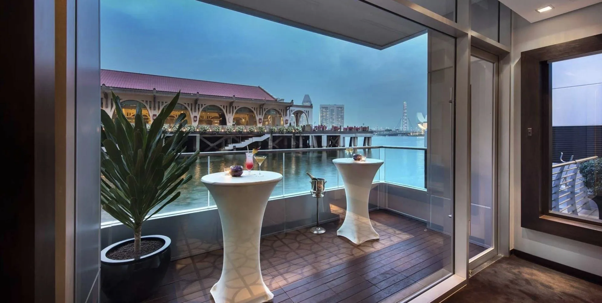 The Floating Pods balcony at The Fullerton Bay Hotel, looking across Marina Bay