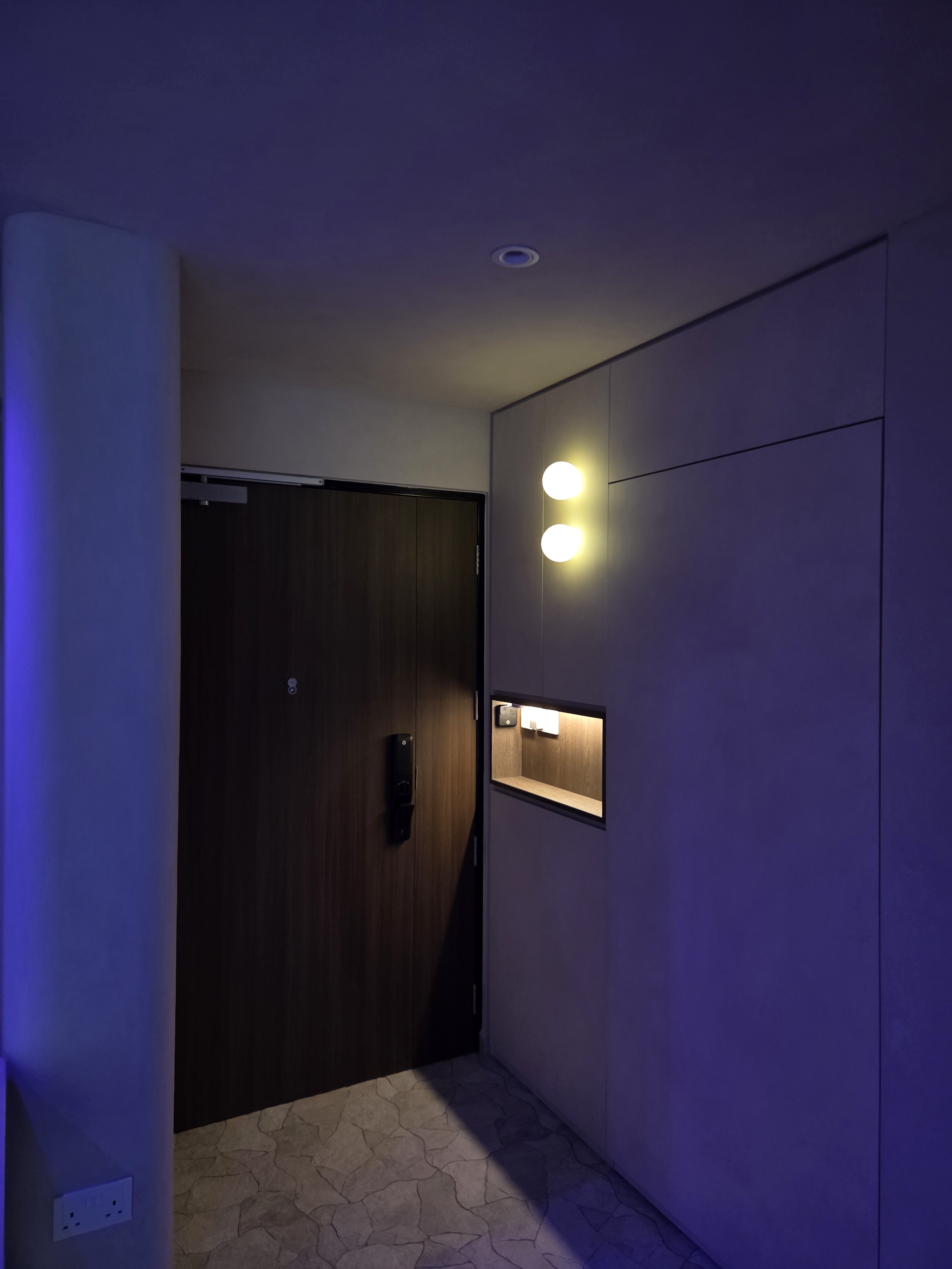 Completed smart lighting project showing a home foyer with a different ambient lighting scene