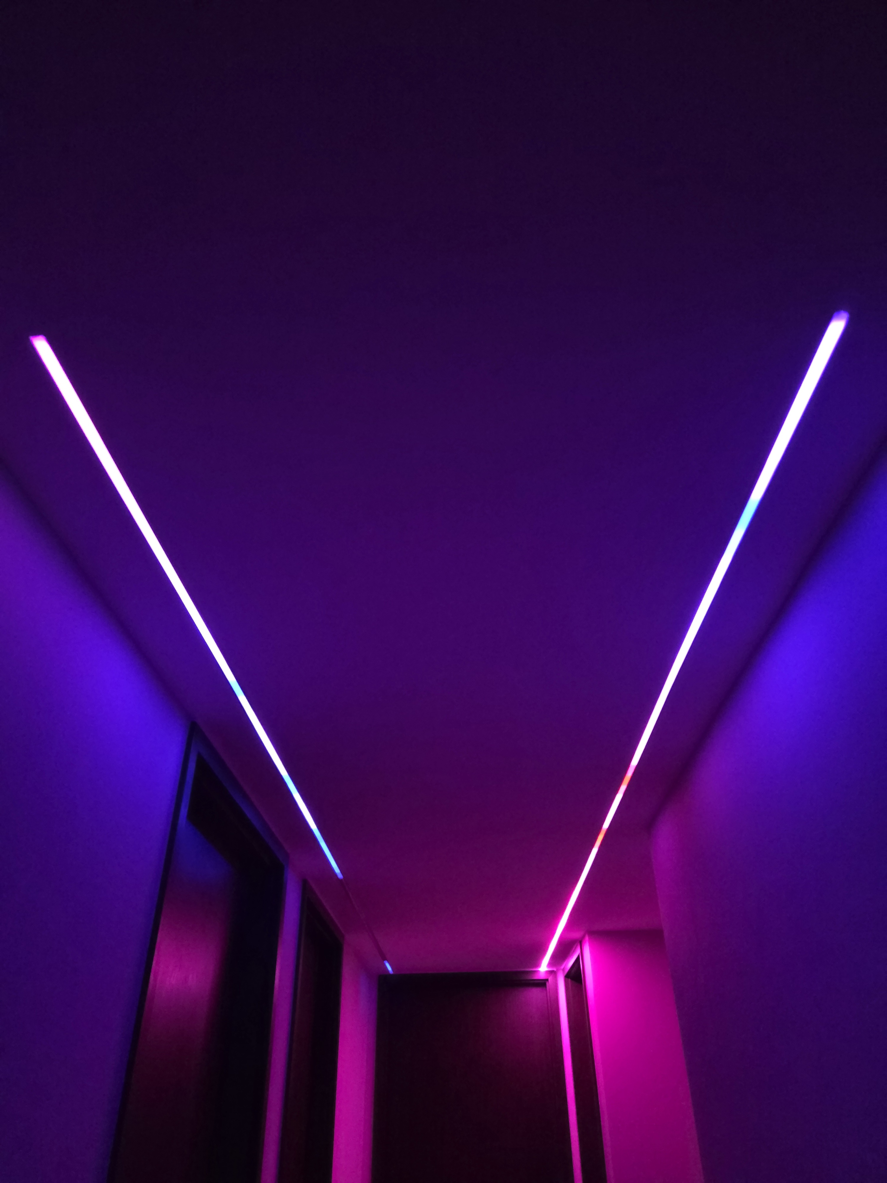 Completed smart lighting project featuring colourful LED strip lighting along a home walkway