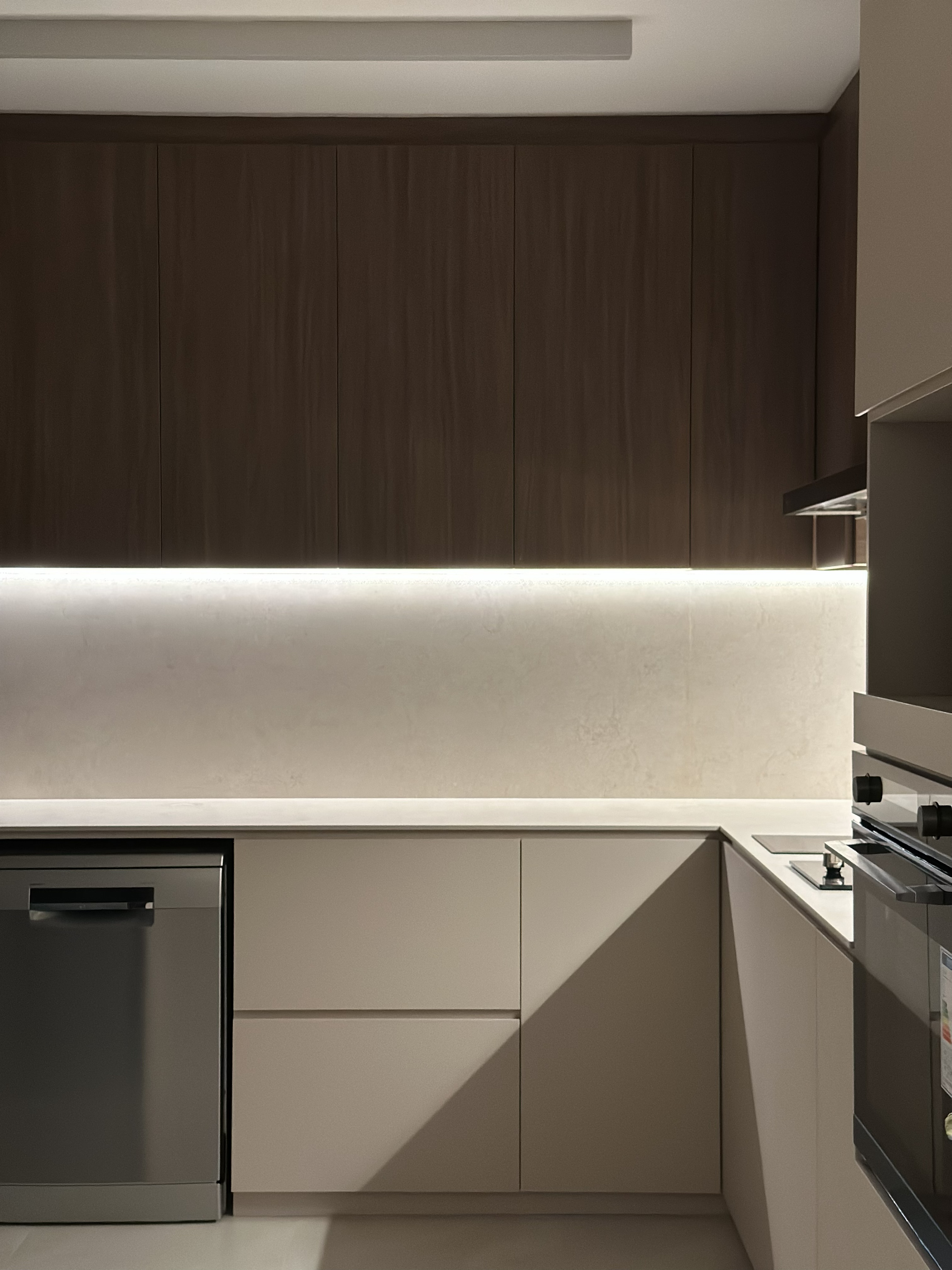 Completed smart home project featuring presence-activated kitchen lighting with dimmable countertop lights for enhanced convenience and functionality