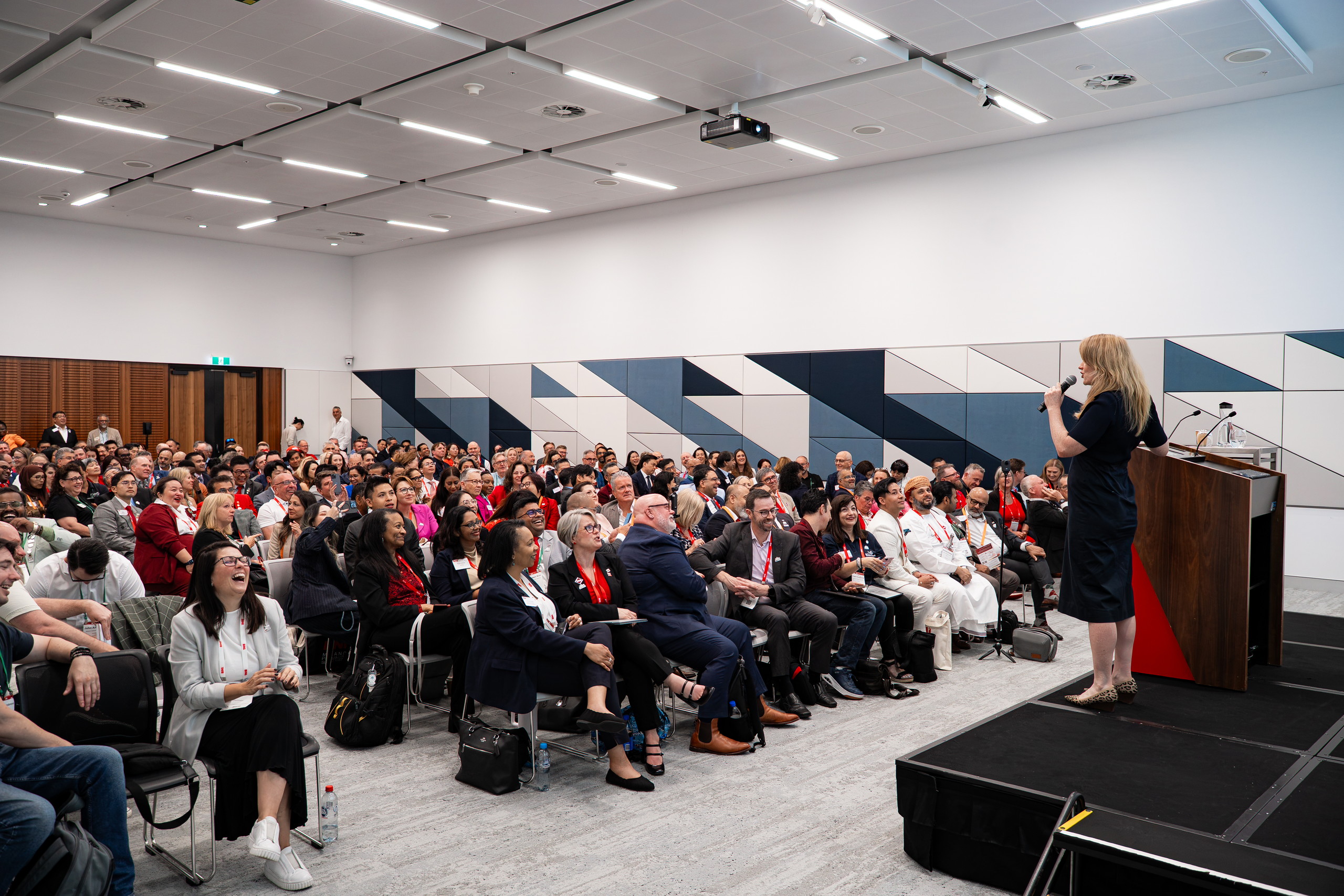 Arabella Macpherson speaking to a full conference audience