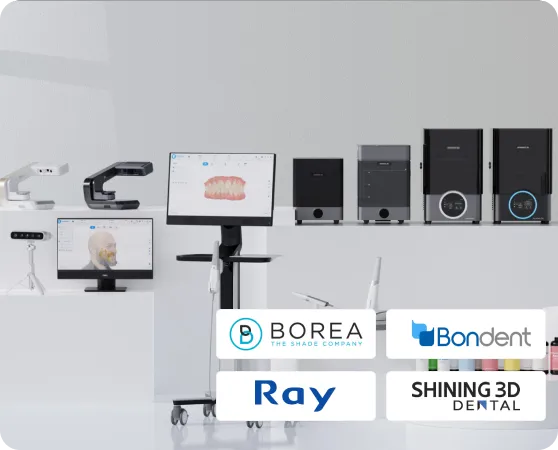 Dental 3D scanners and printers displayed on white pedestals in a bright room with brand logos below.