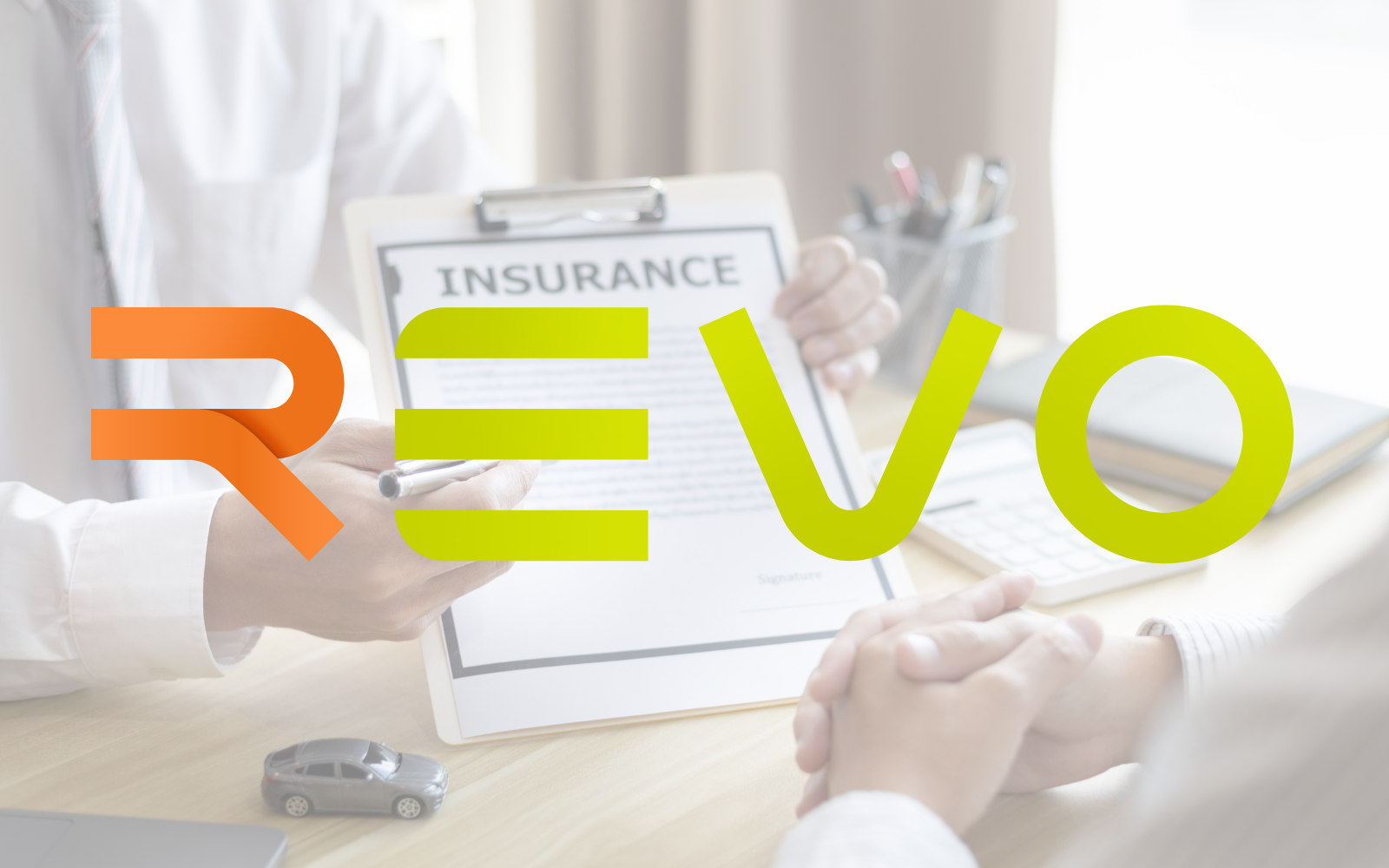 REVO logo over insurance papers