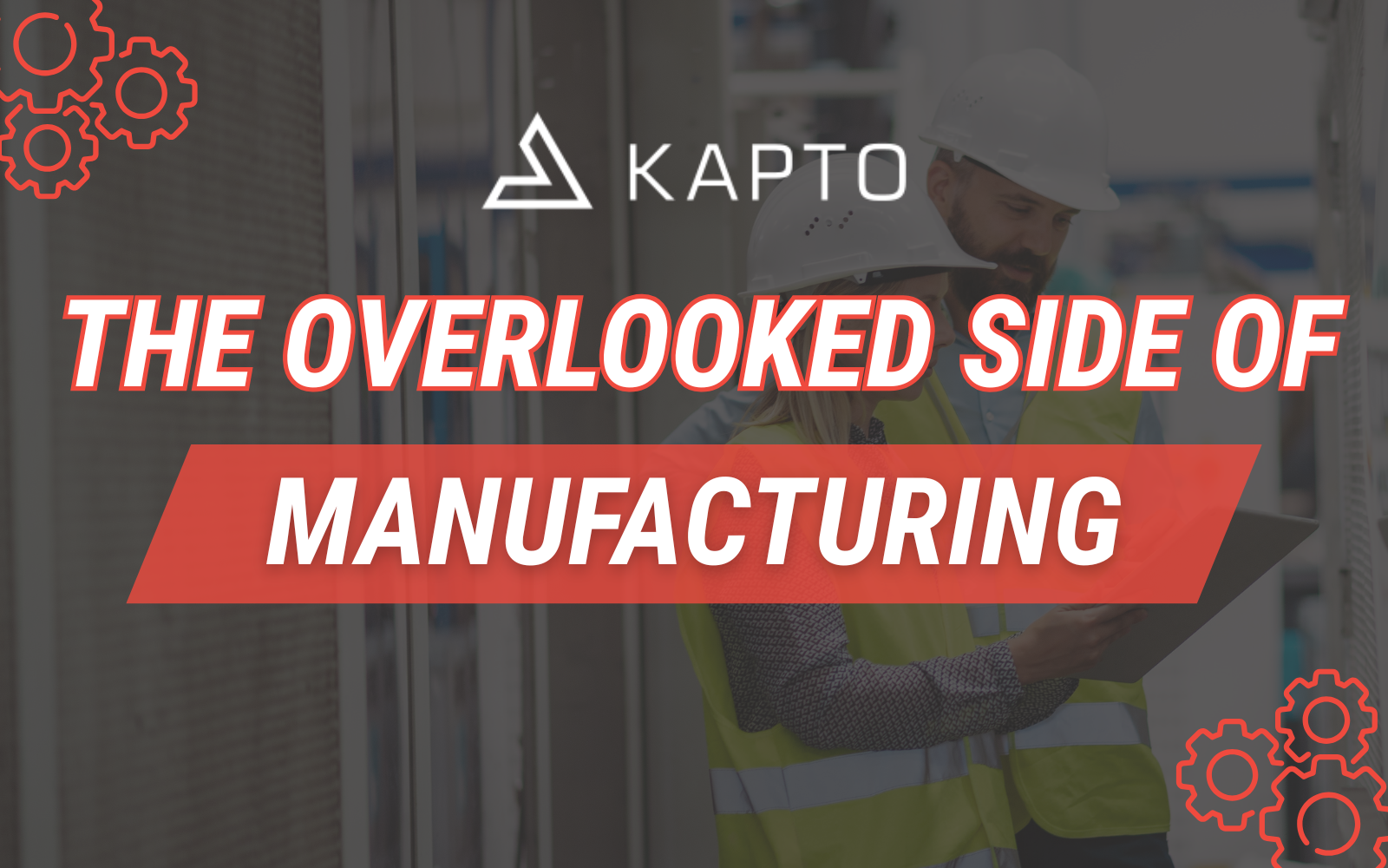 Manufacturing workers reviewing data on a tablet in an industrial environment