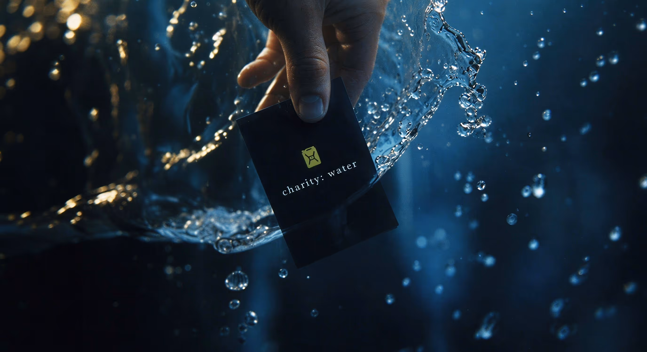 photography of charity: water playing cards submerged in water