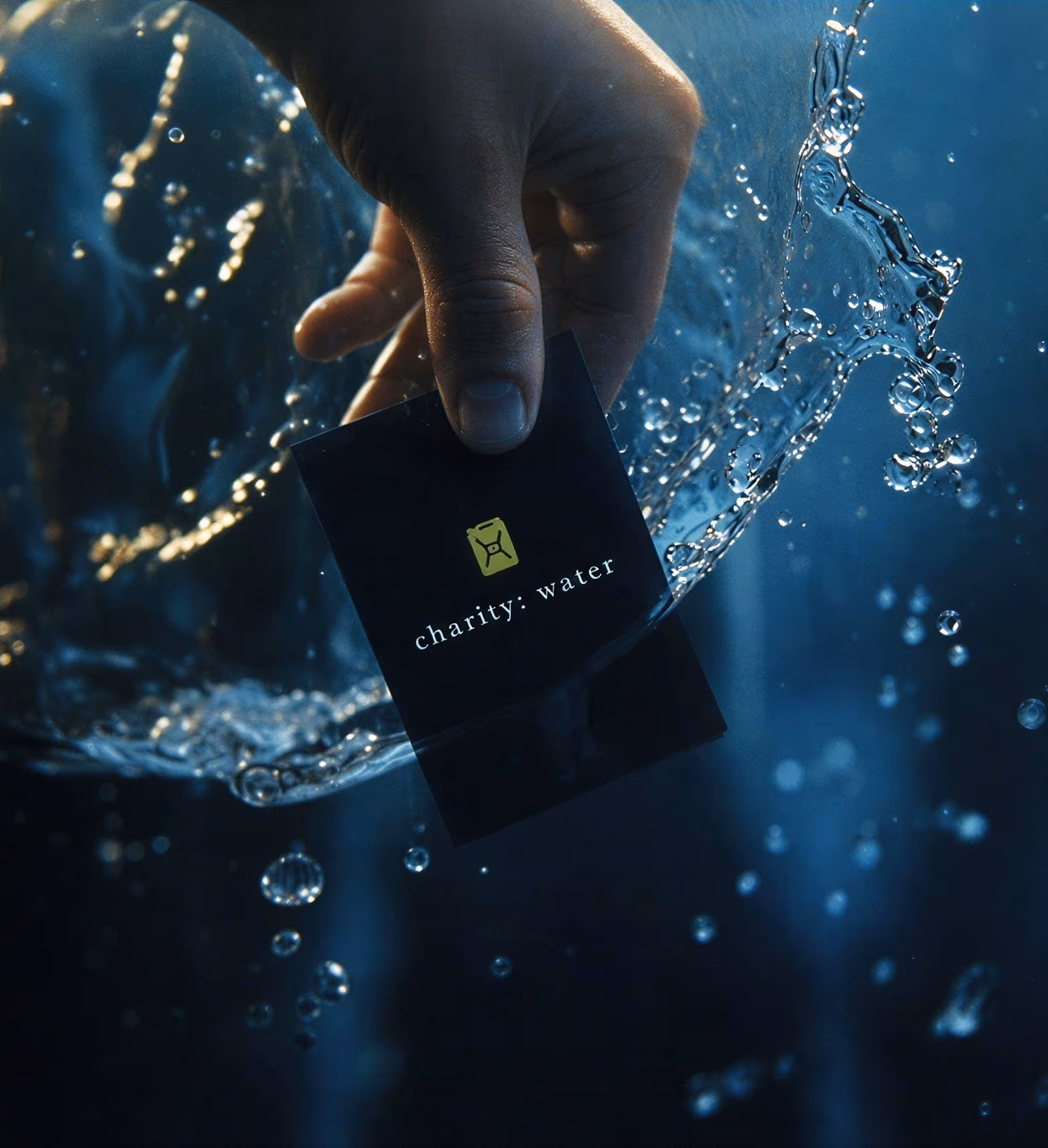 photography of charity: water playing cards submerged in water